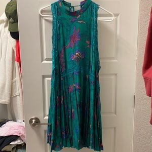 Printed mini shift dress with lace details and deep open back.